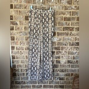 BY TOGETHER Pants for Women Snakeskin design size Large. Bell bottoms.